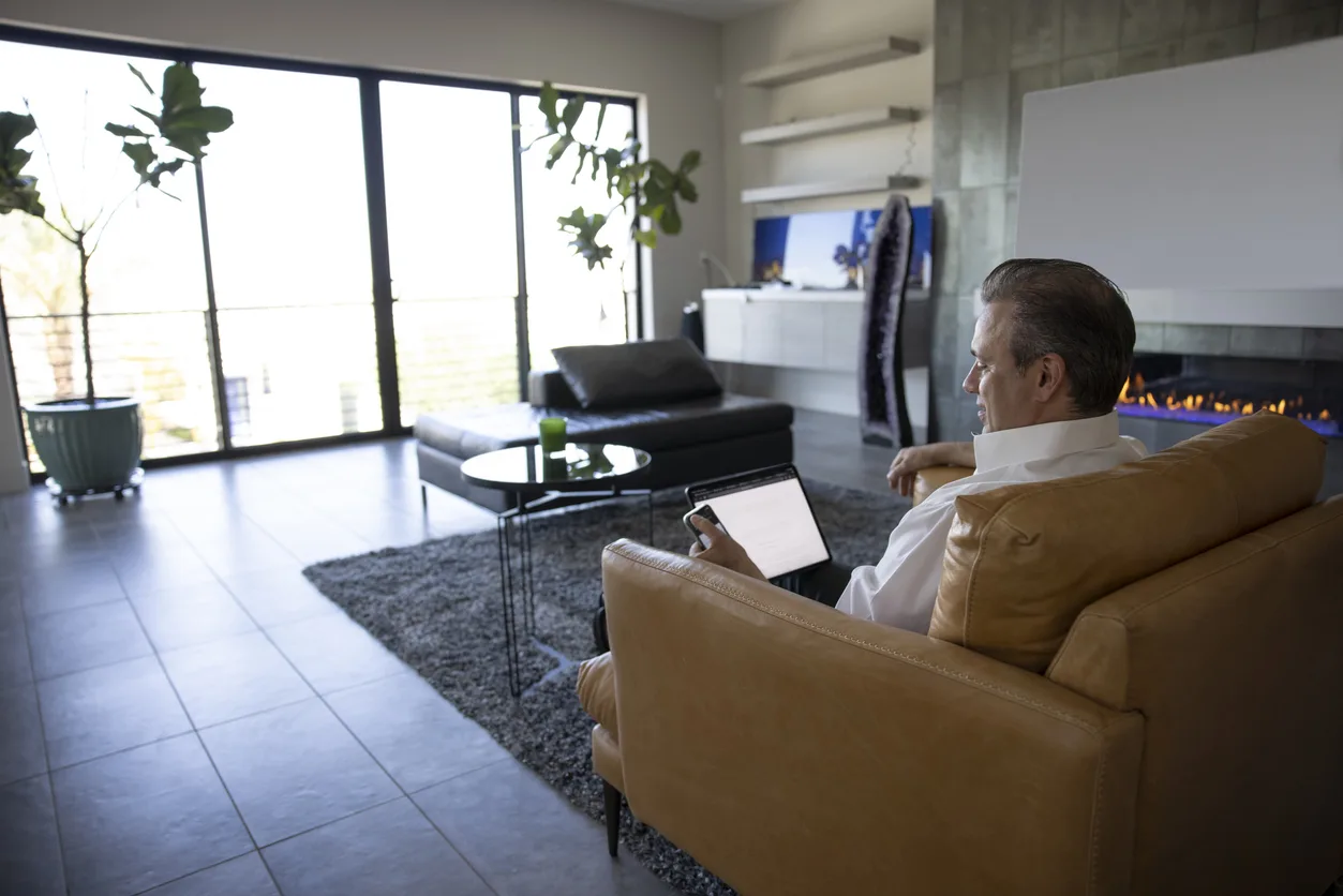 An attorney protecting client confidentiality on a laptop