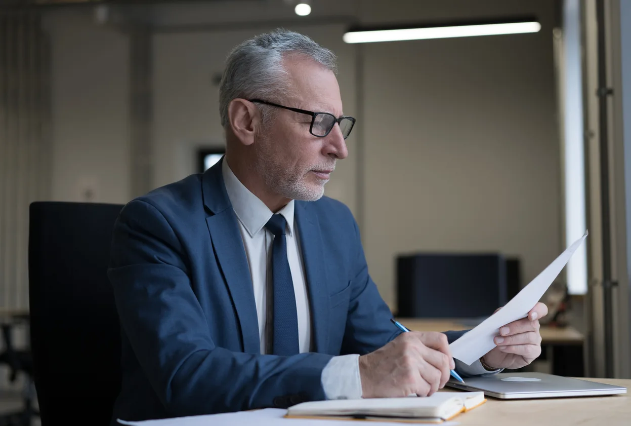 An attorney reviewing medical records in a malpractice matter