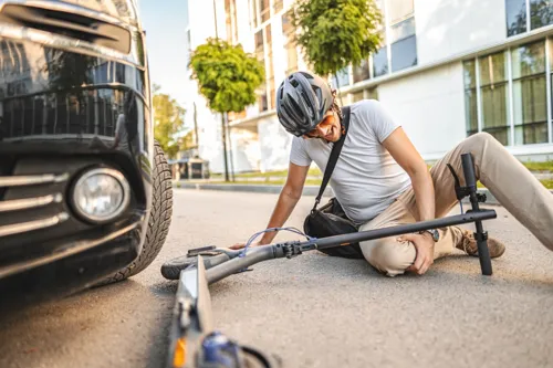 An injured cyclist after an accident, the kind of personal injury matter often referred to a specialist